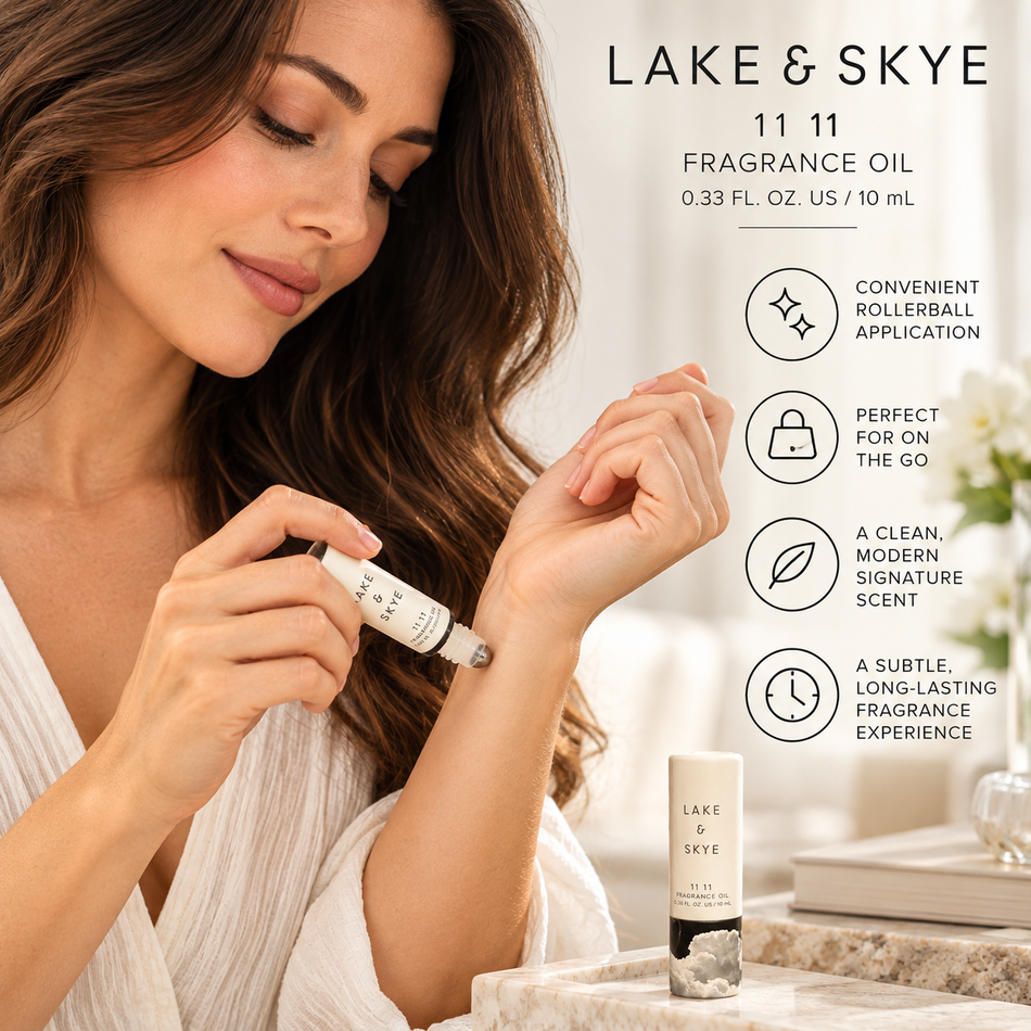 Woman applying Lake & Skye 11 11 Rollerball Fragrance Oil 0.33 oz 10ml to her wrist, featuring the portable fragrance oil and elegant everyday beauty routine