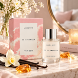 Lake & Skye 11 11 Vanilla Eau de Parfum 1.7 oz (50ml) perfume bottle with pink cloud-inspired packaging, styled on an elegant marble vanity with vanilla flowers, soft candlelight, and warm amber accents.