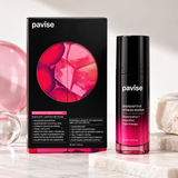 Pavise Bioadaptive Stress Repair 30ml nighttime facial treatment displayed with black and pink packaging on an elegant marble vanity with soft lighting, flowers, and skincare accessories.