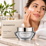 SkinMedica Dermal Repair Cream 1.7 oz (50 mL) facial moisturizer displayed with its packaging as a woman applies cream to her cheek in a luxury skincare setting.